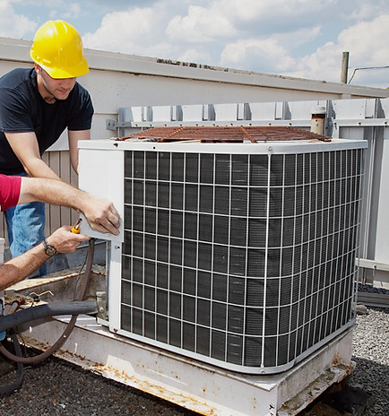 Outback HVAC technicians servicing an air conditioning unit