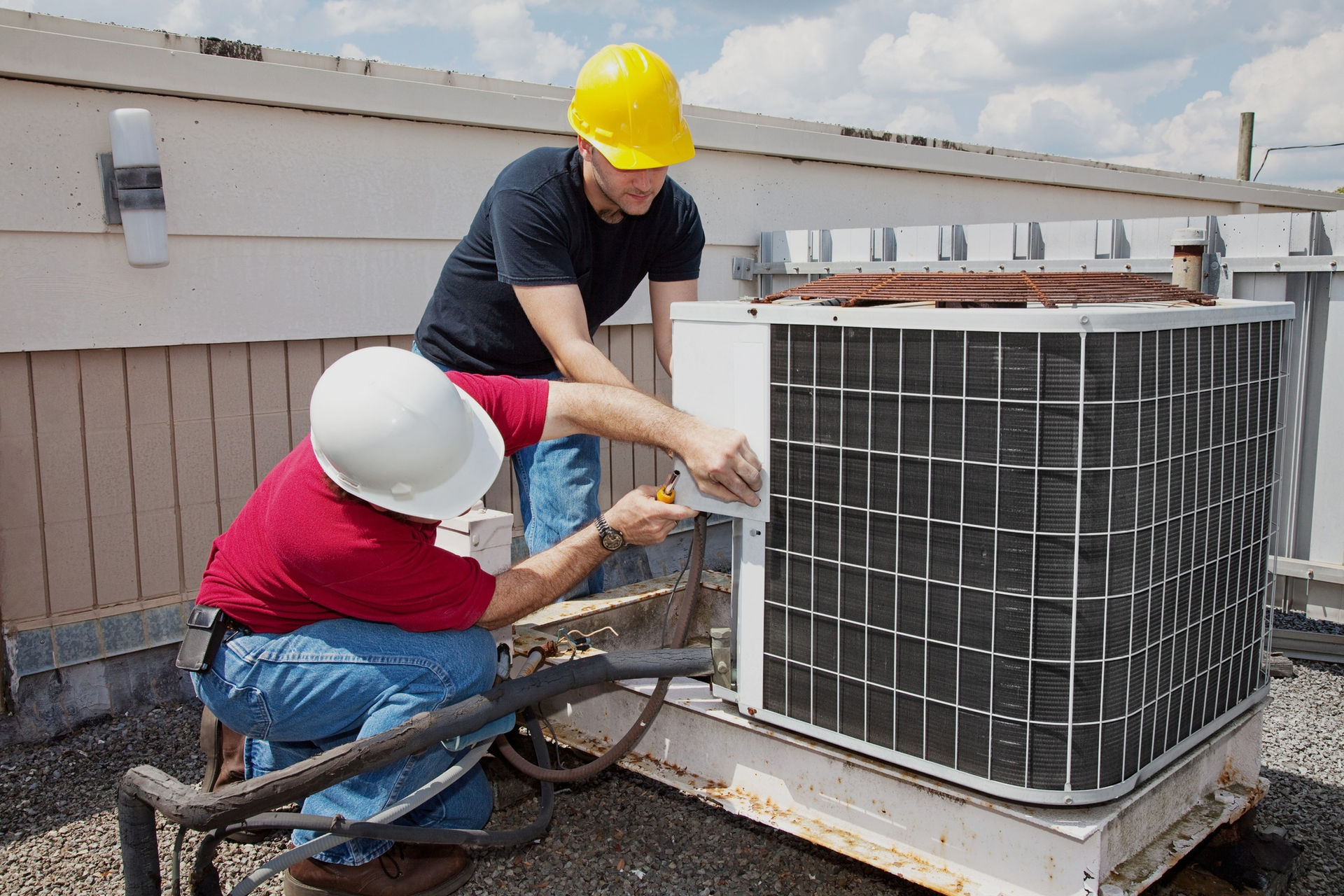 Technician repairing an air conditioner